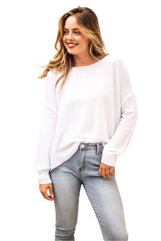 White light weight sweater styled with jeans.