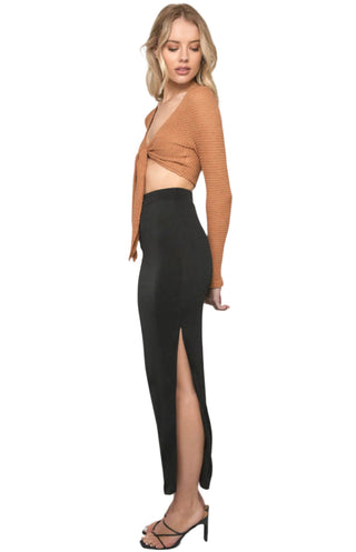 Side view of fitted high waisted maxi skirt with side split.