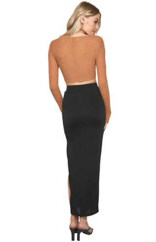 Full back view of black high waisted fitted stretch maxi skirt.