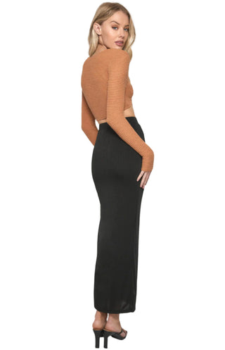 Back view of fitted black maxi skirt.